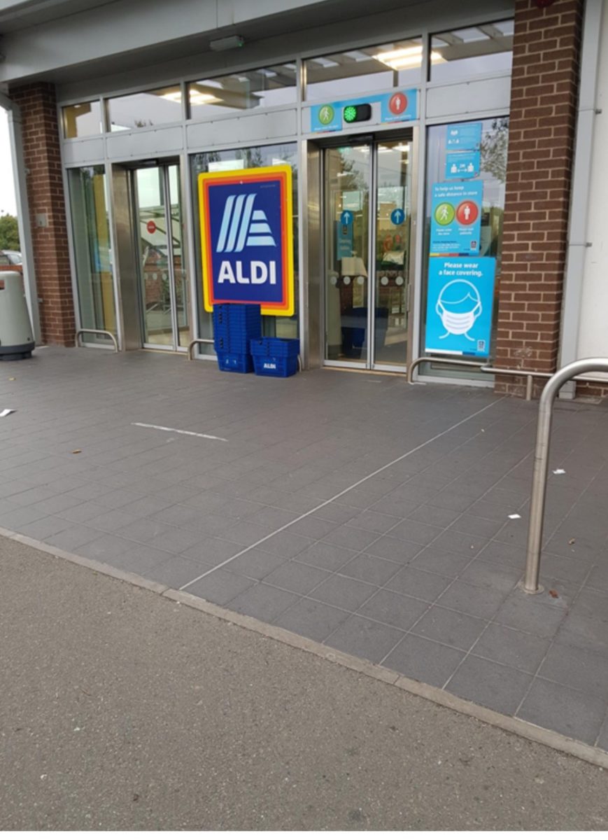 Level access entrance with automatic doors