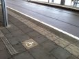 These soft paving slabs indicate where along the platform the doors of the tram will open for people with sight impairme