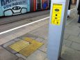 Soft paving indicating tram door locations and help point