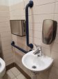 Sink with lever tap & navy grab rails.