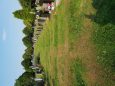 Grass between grave stones. Very uneven.